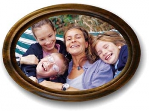 An oval framed picture of a single mom and her kids.