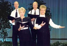 Four people read scripts in a Choral Reading.